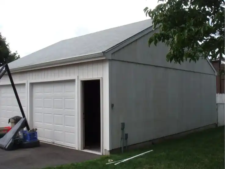 Grey garage with a plain side door